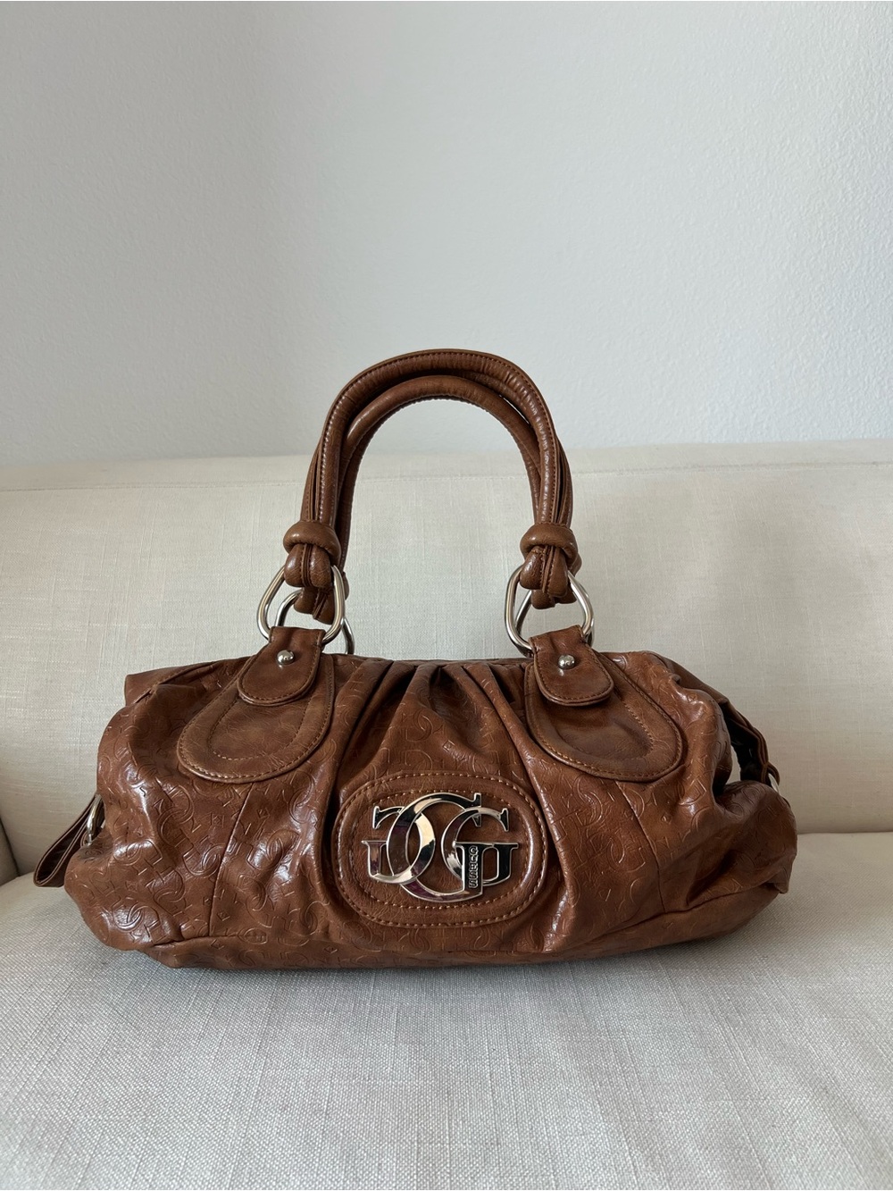 Embossed Monogram Bowling Bag — Cognac